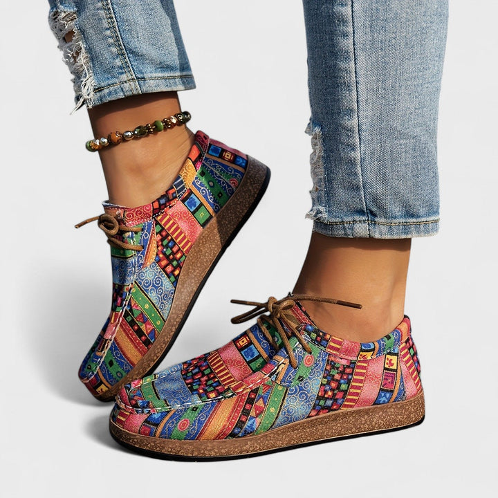 Top-down view of lace-up orthopaedic trainers for women with roomy toe box and patchwork panels