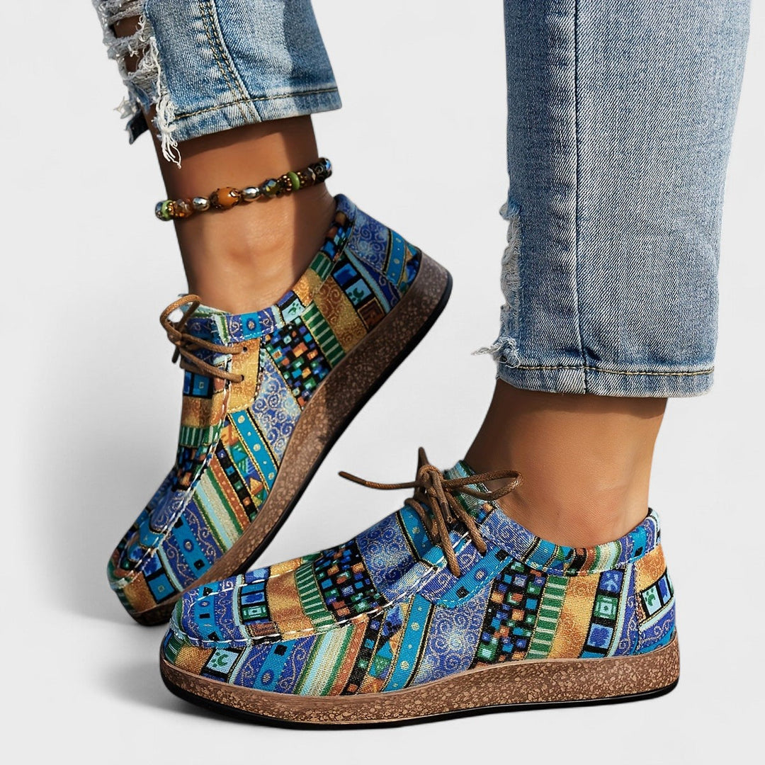 Detail shot of orthopaedic sneakers for women highlighting wide sole and secure lace-up fastening