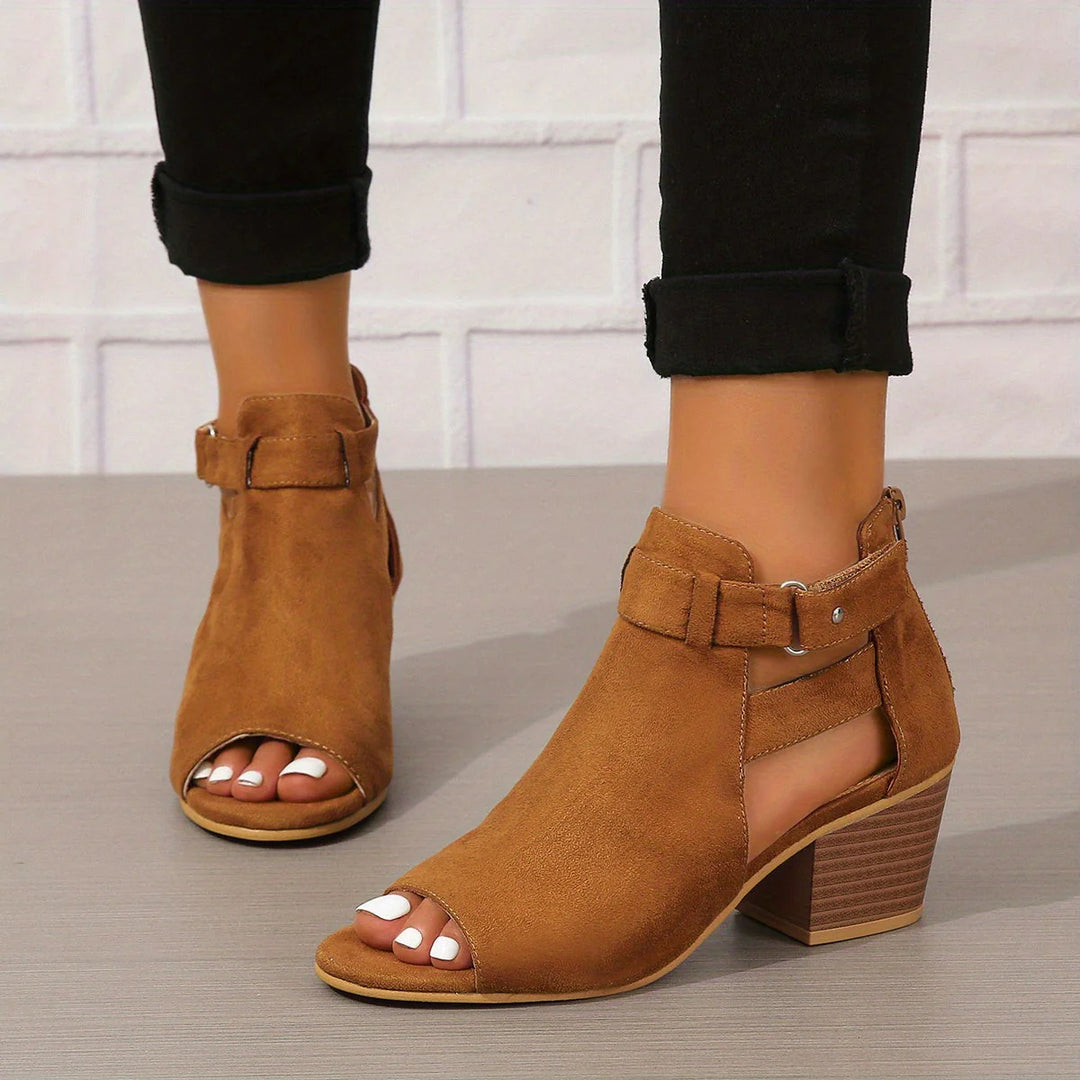 Multiple colourways of women's block heel sandals displayed together showing versatility