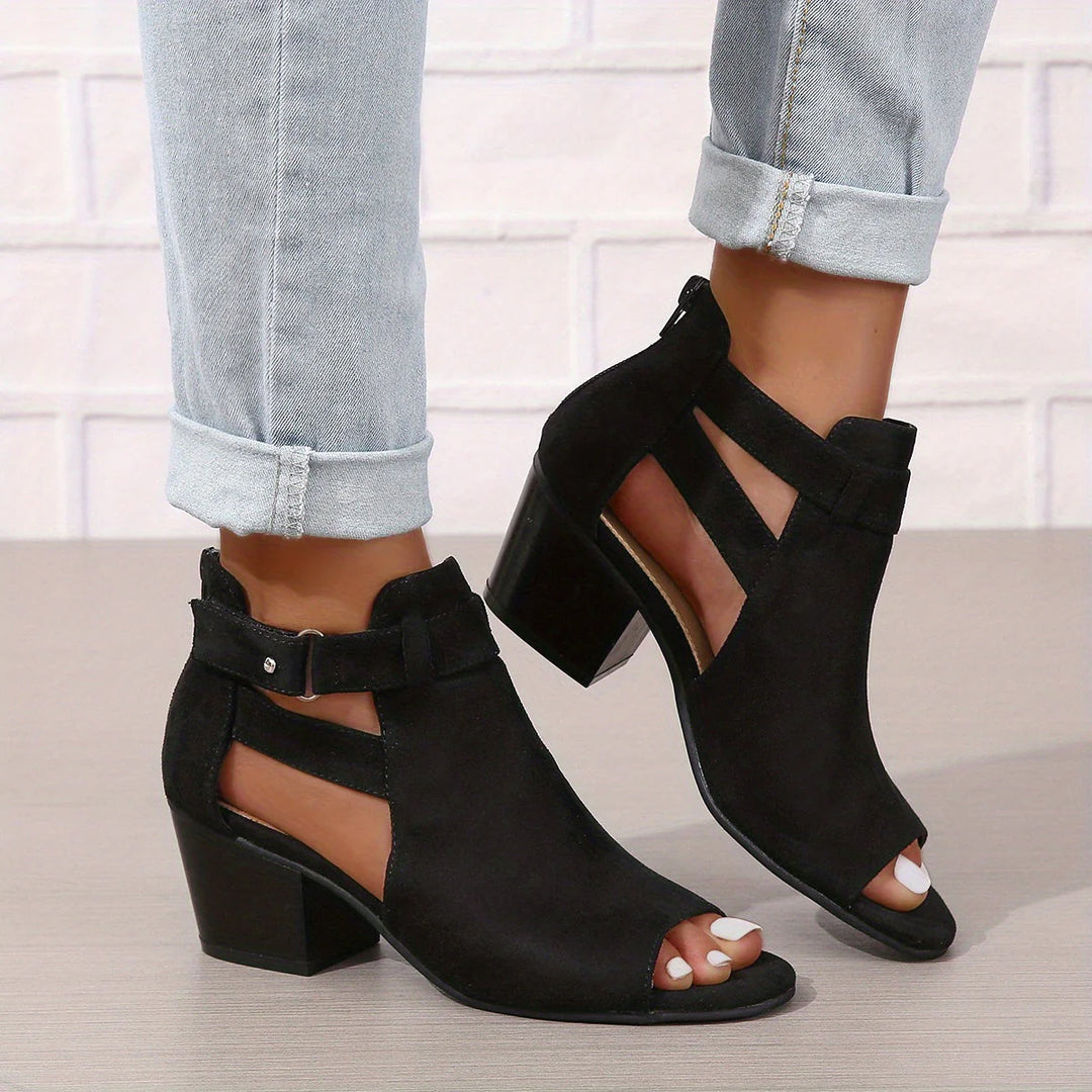 Side profile of women's block heel sandals with adjustable buckle strap and open toe design