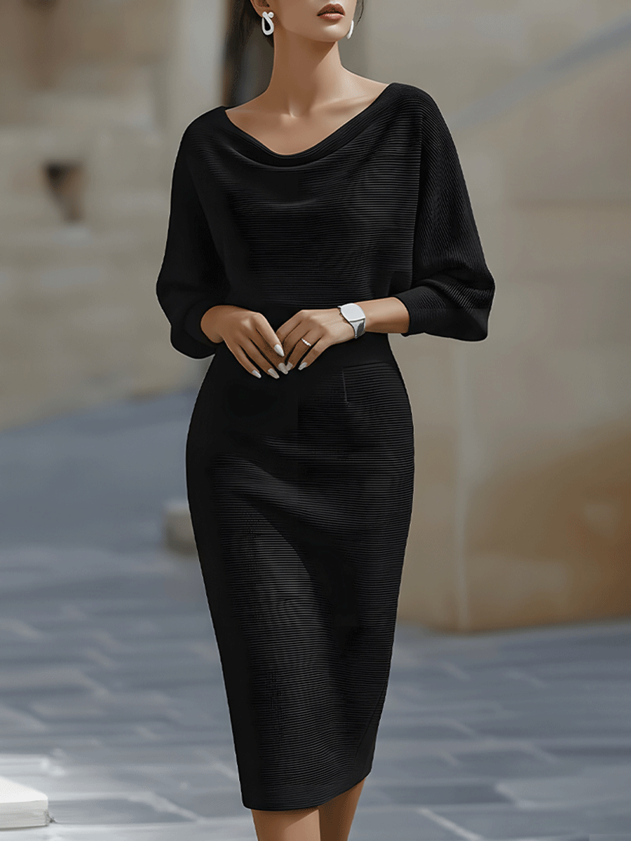 Back view showing the boat neckline and batwing sleeve construction of the midi dress