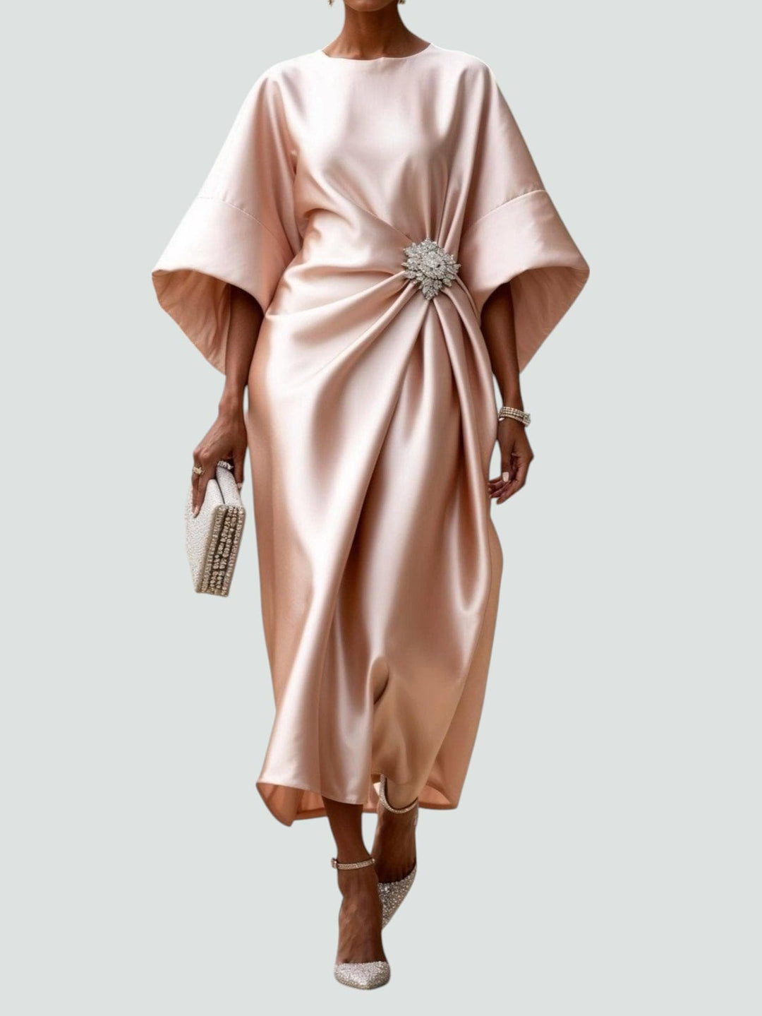 Women's Elegant Draped Brooch Maxi Dress styled with embellished heels for evening wear