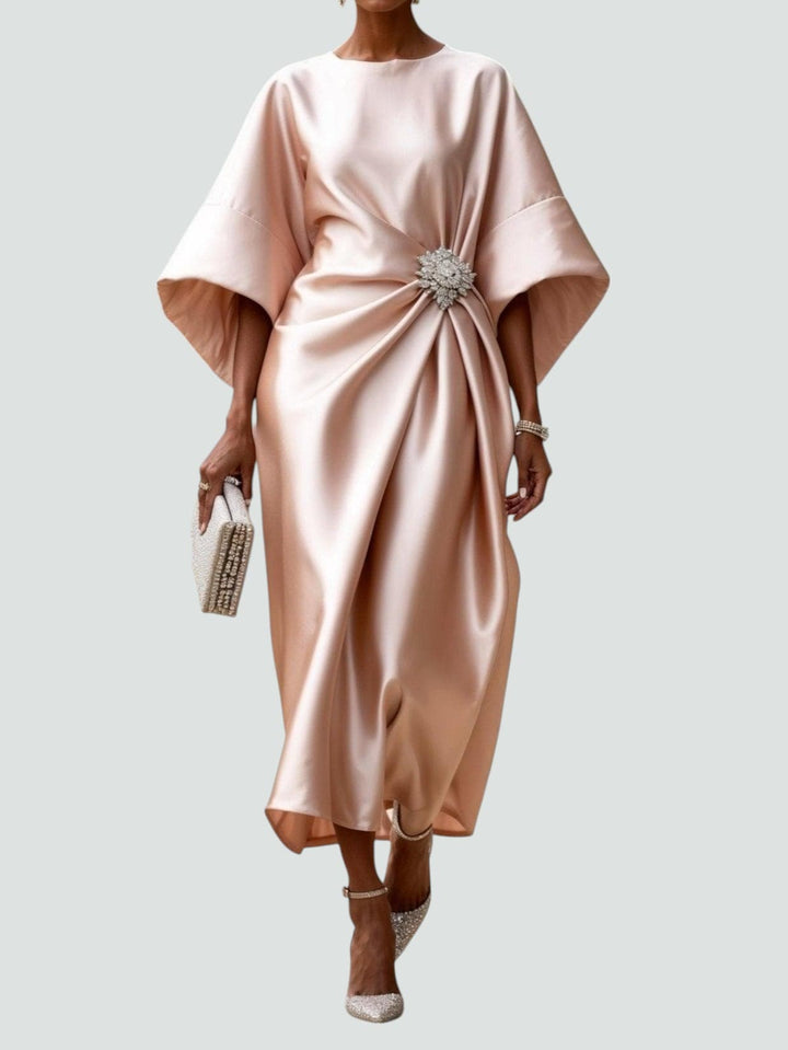 Women's Elegant Draped Brooch Maxi Dress styled with embellished heels for evening wear