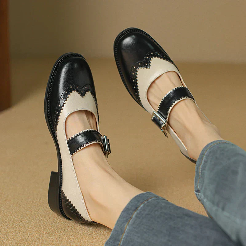 Amelia wearing Women's Everyday Leather Mary Janes with two-tone scalloped design and adjustable buckle strap