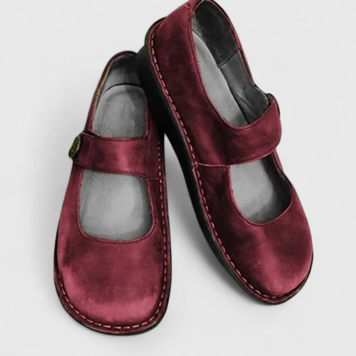 Side view of women's Mary Jane loafers with structured upper and flat sole