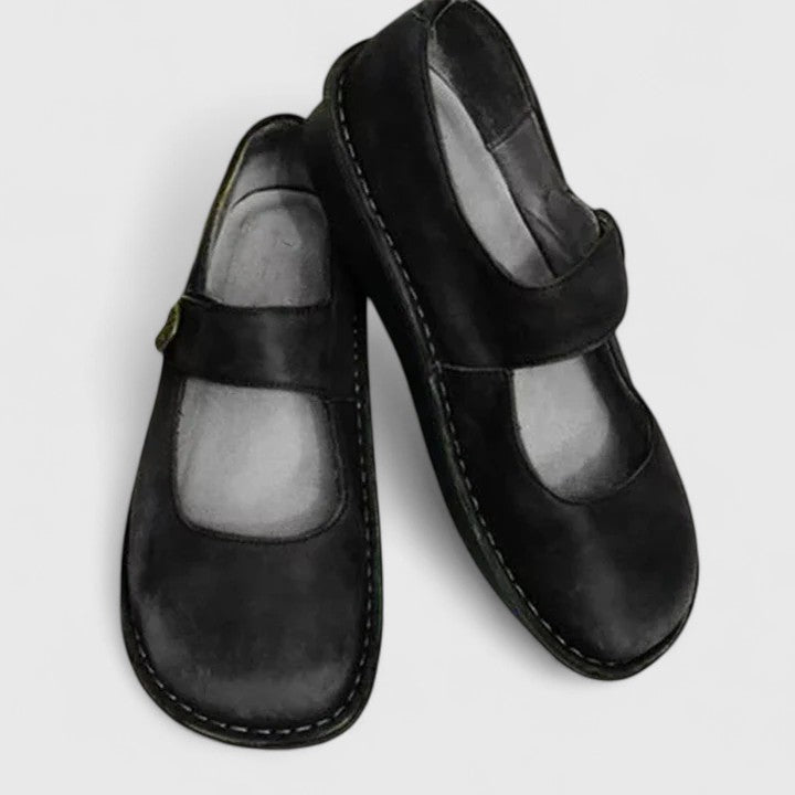 Pair of Mary Jane loafers displayed together showing classic strap design
