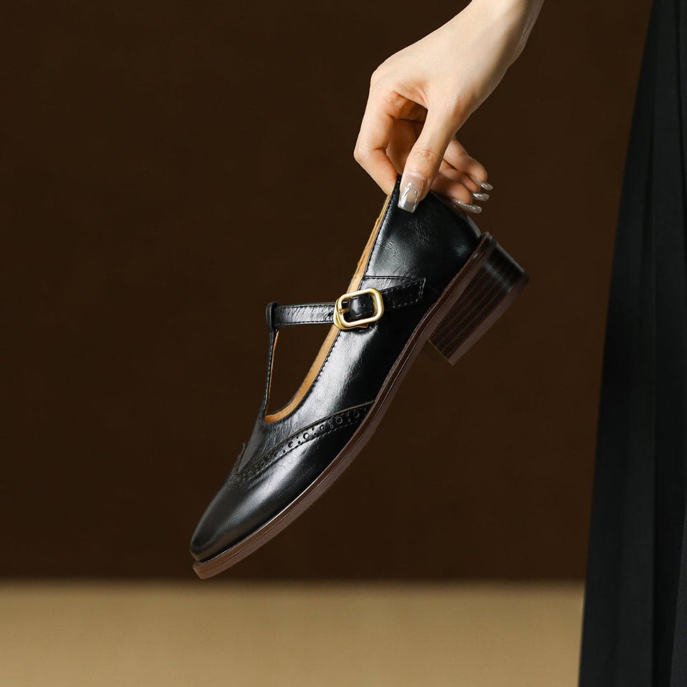 Close-up of adjustable buckle fastening and perforated brogue design on orthopaedic mary jane shoes