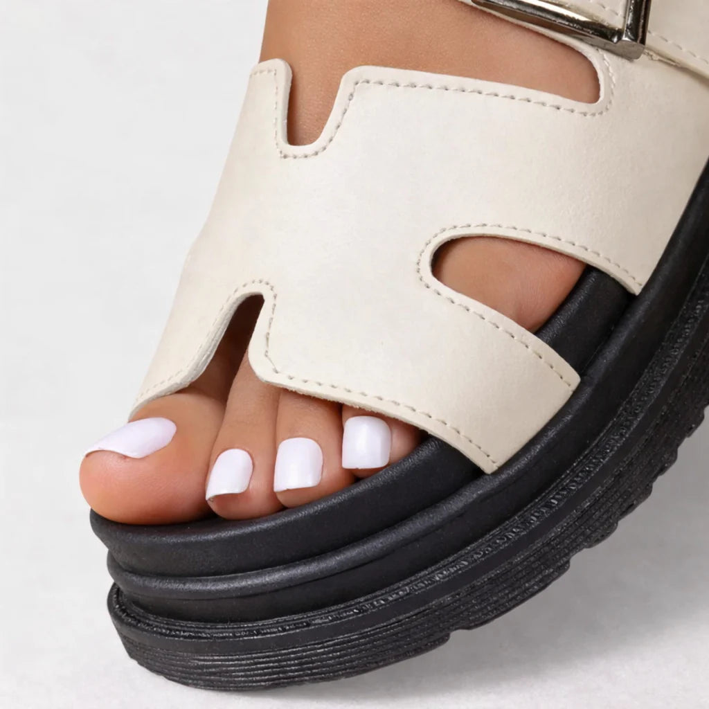 Women's platform sandals styled with casual outfit, showing adjustable strap and minimal design