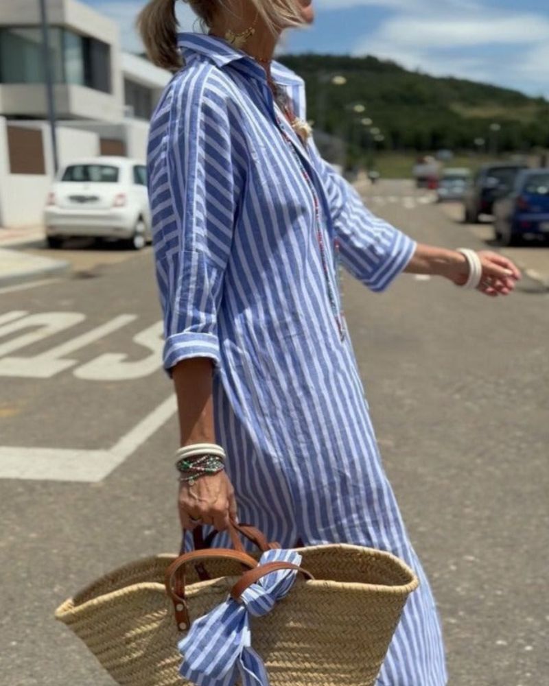 Side view of Women Striped Button Front Midi Shirt Dress displaying relaxed silhouette and midi length hem