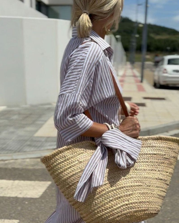 Detail shot of Women Striped Button Front Midi Shirt Dress fabric showing vertical stripe pattern and soft drape