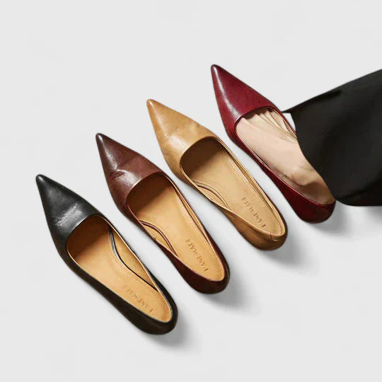 Women's kitten heel pumps with orthopedic support worn for formal occasion
