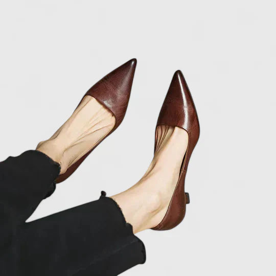 Detailed view of low kitten heel and smooth finish on supportive pumps