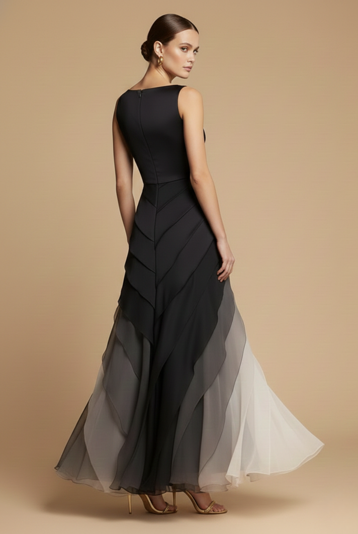 Side profile of the Women's Black Formal Maxi Dress showing the asymmetric layered skirt