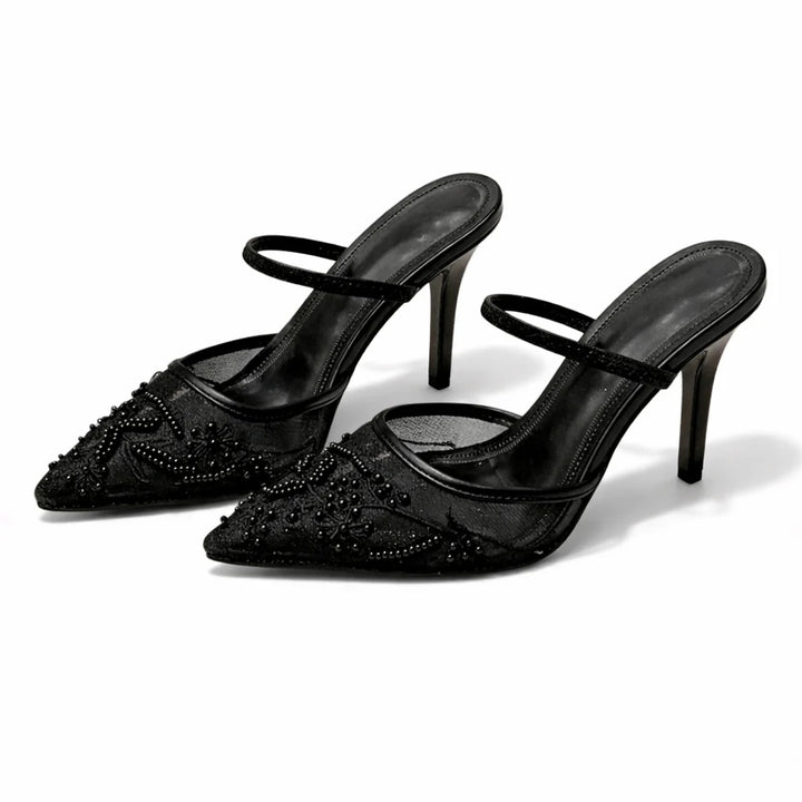 Detail shot of floral embroidery on mesh mule heels with pointed toe shape