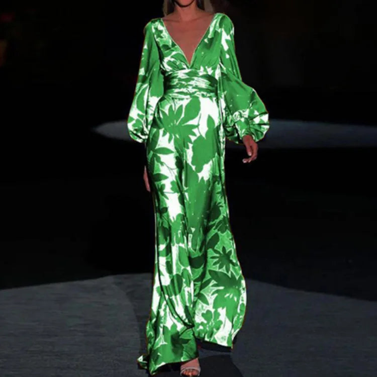 Back view of V-neck printed maxi dress with gathered sleeve cuffs and floor-length hem