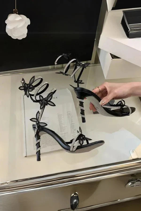 Butterfly ankle strap heels in gold finish with adjustable lace-up design for summer occasions