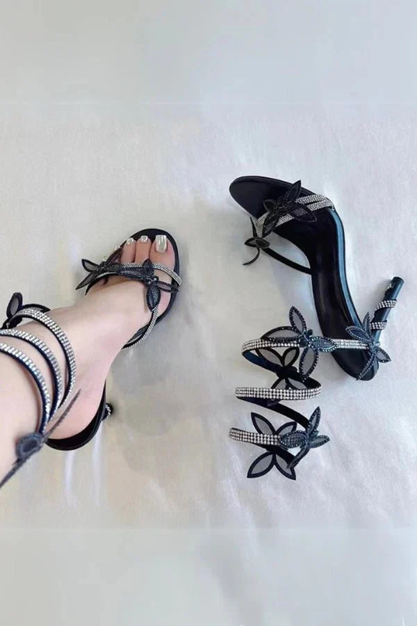 Butterfly ankle strap heels worn with dress showing leg-lengthening heel and secure fit