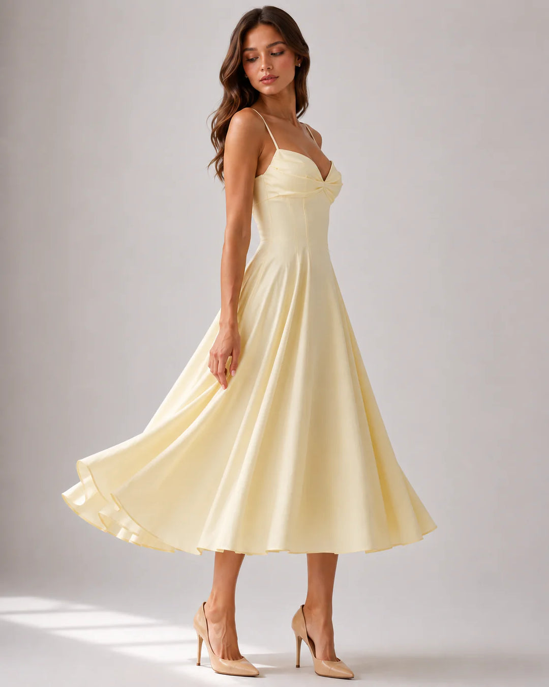 Back view of midi dress featuring concealed zip closure and flowing skirt