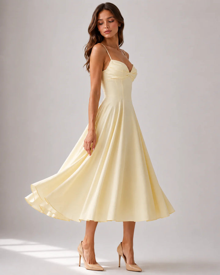 Back view of midi dress featuring concealed zip closure and flowing skirt