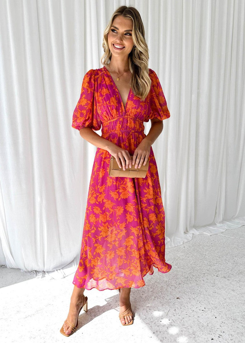 Floral maxi dress with V-neckline and gathered waist detail shown from the front
