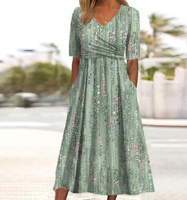 Sage green A-Line Midi Dress V-Neck Floral Short Sleeve Summer with wrap bodice and soft botanical print worn outdoors