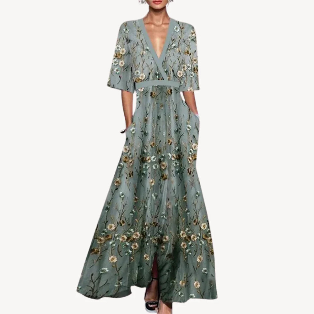 Close-up of Women's Elegant Maxi Wedding Guest Evening Dress showing wrap-style bodice and half sleeves