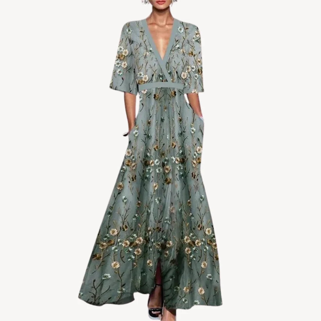 Close-up of Women's Elegant Maxi Wedding Guest Evening Dress showing wrap-style bodice and half sleeves