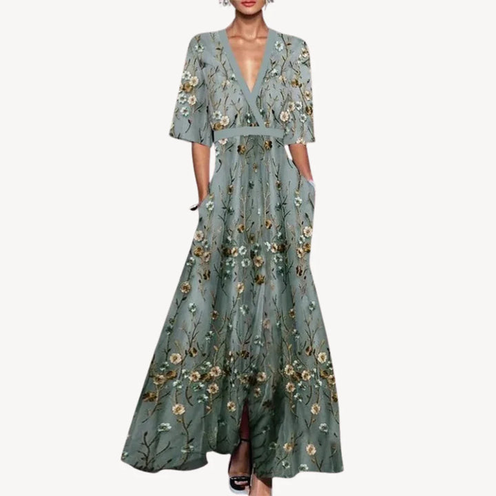 Close-up of Women's Elegant Maxi Wedding Guest Evening Dress showing wrap-style bodice and half sleeves