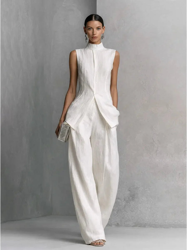 Side view of women's stand collar two piece set showing high-low hem detail and wide leg silhouette