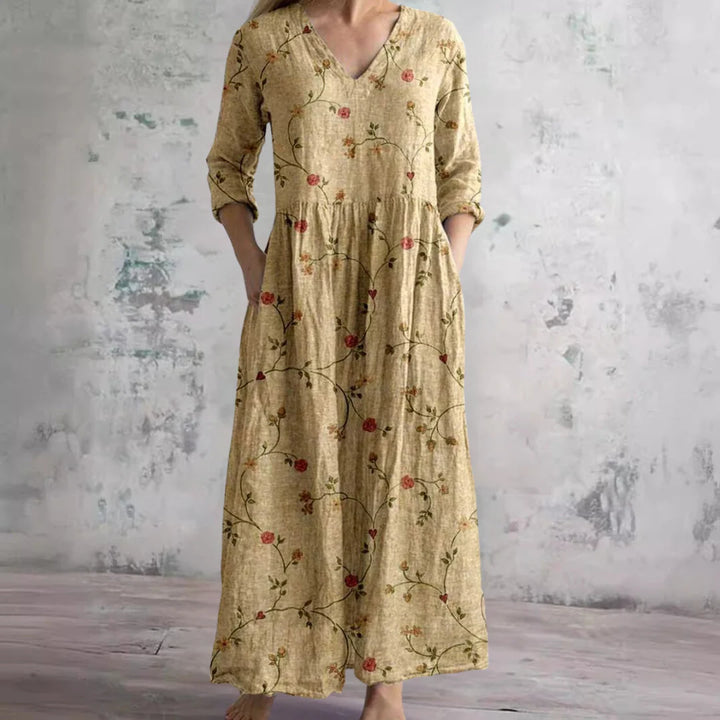 Full-length view of floral pattern dress with V-neckline and side pockets