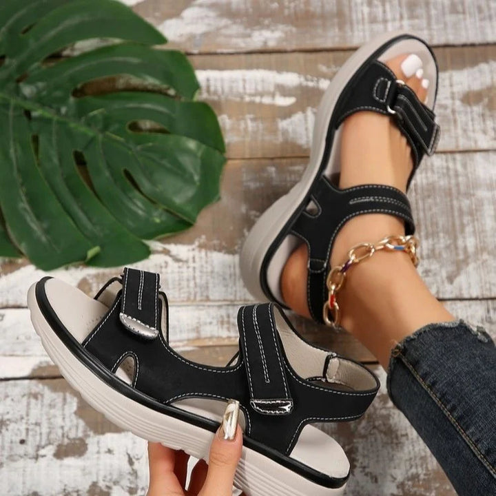 Women's orthopaedic sandals displayed on foot demonstrating adjustable strap fit and open-toe breathable design