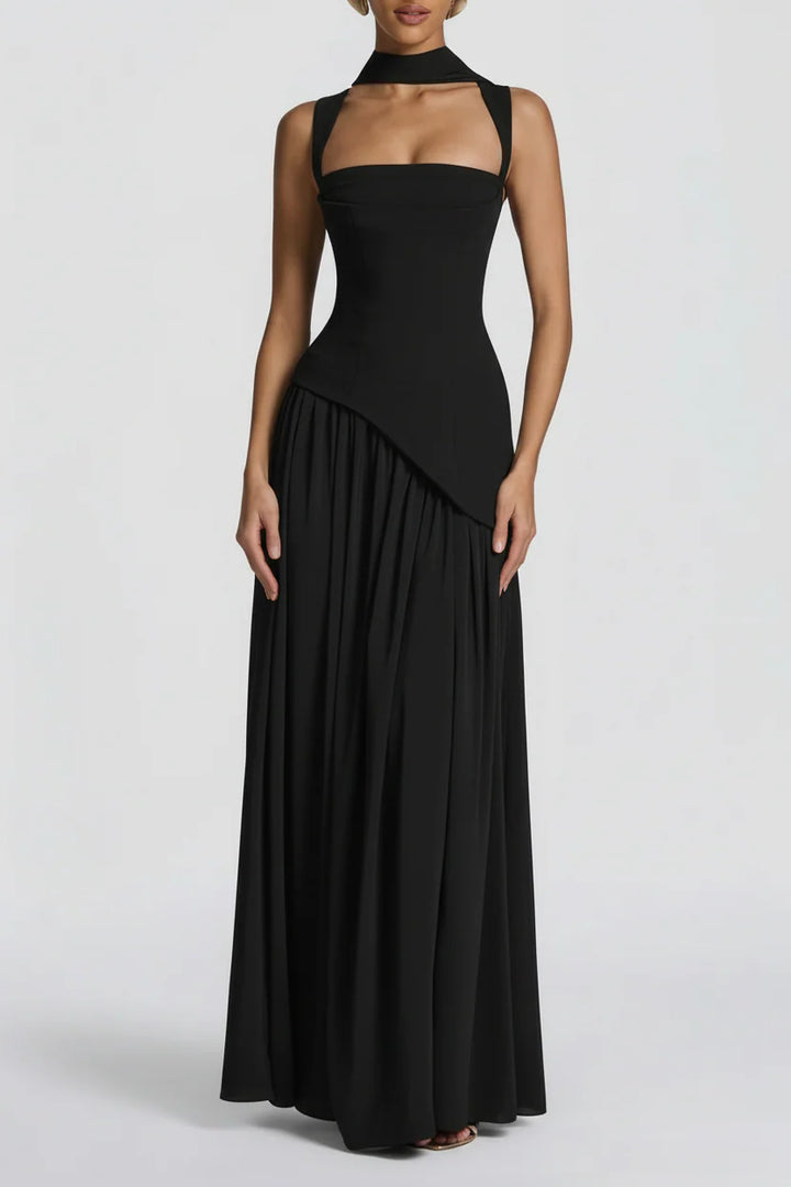 Side angle of Women's Black Maxi Dress highlighting high slit detail and asymmetric hem with floor-length drape