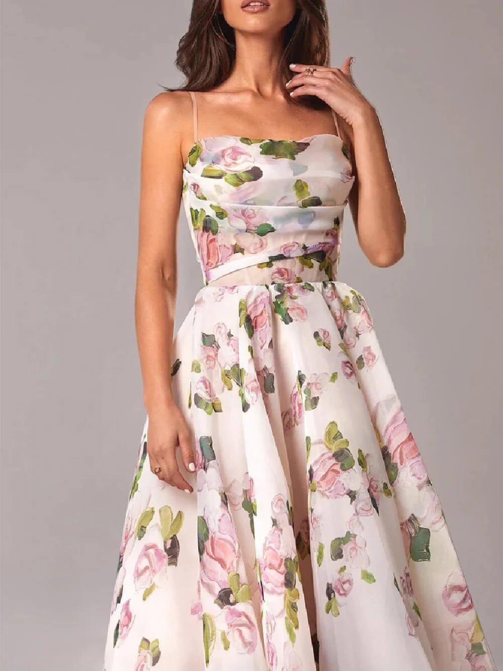 Detail of floral midi dress showing watercolour rose print, fitted bodice, and graceful A-line silhouette for spring events