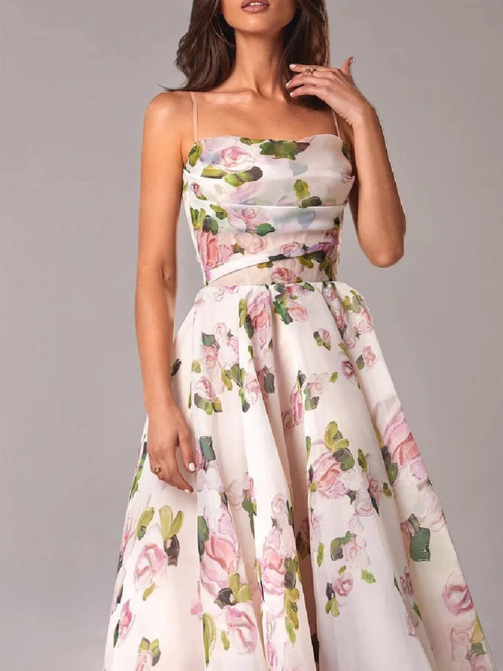 Detail of floral midi dress showing watercolour rose print, fitted bodice, and graceful A-line silhouette for spring events