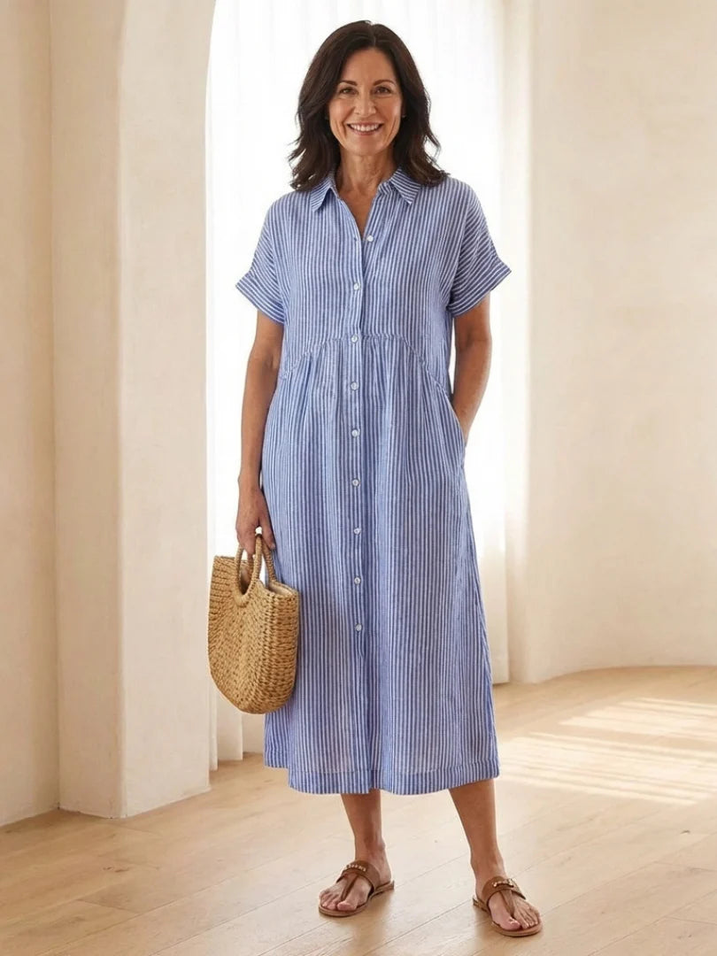 Striped button front short sleeve midi dress with gathered waist and side pockets in blue and white vertical stripes