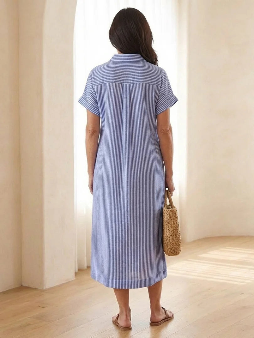 Front view of relaxed fit midi dress with shirt collar and full button closure in striped pattern