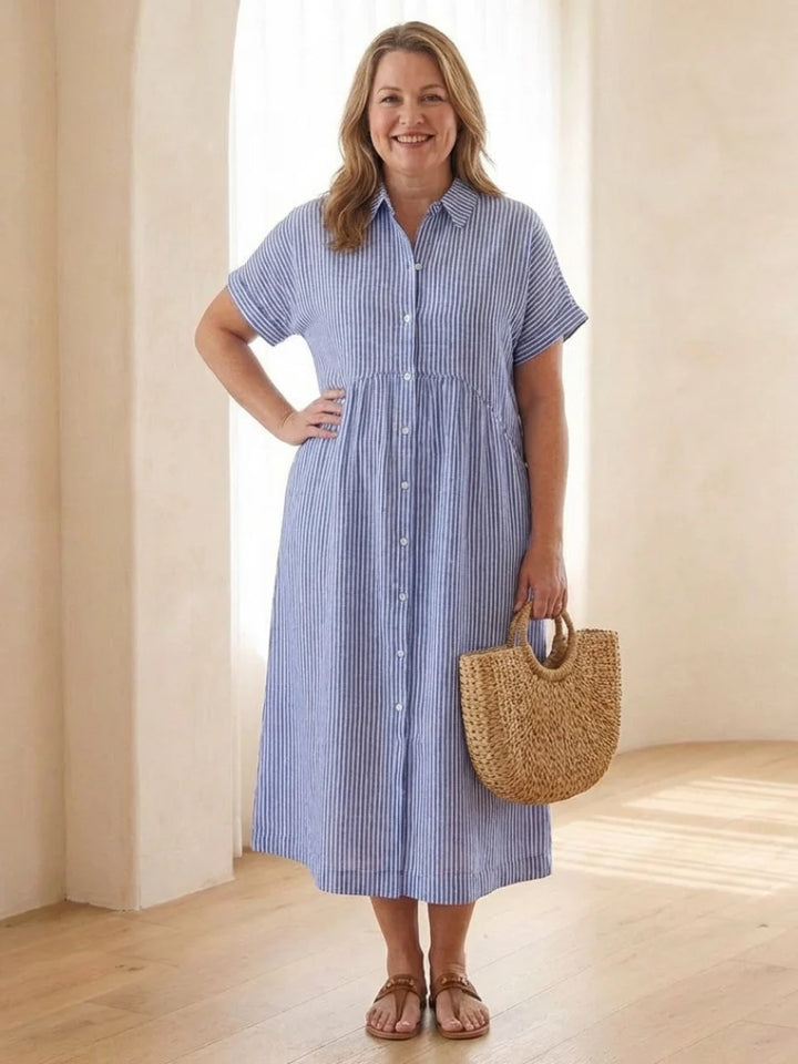Side detail of short sleeve midi dress showing gathered waist and functional side pockets