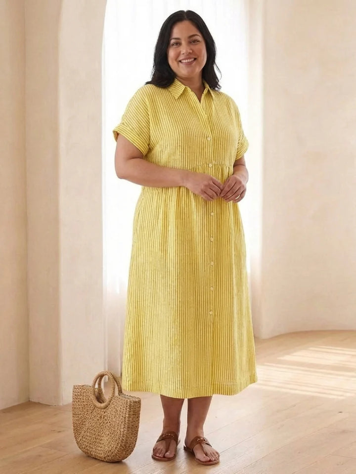 Close-up of vertical stripe pattern and button front closure on midi dress