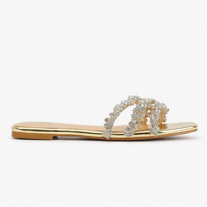 Full view of women's diamante flat sandals showing slip-on design and metallic finish