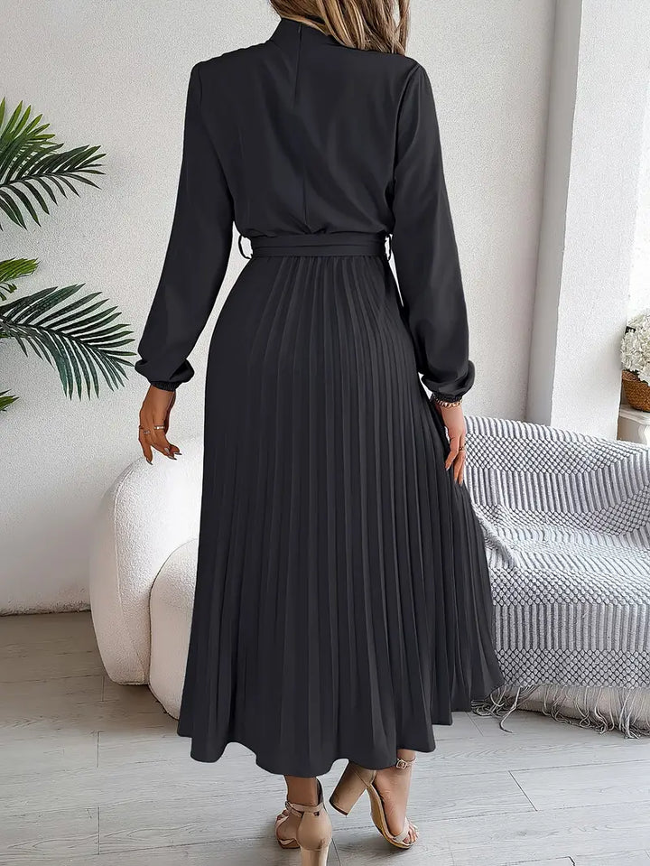 Women's Long Sleeve Pleated Belted Dress in black with accordion pleats and elasticated cuffs