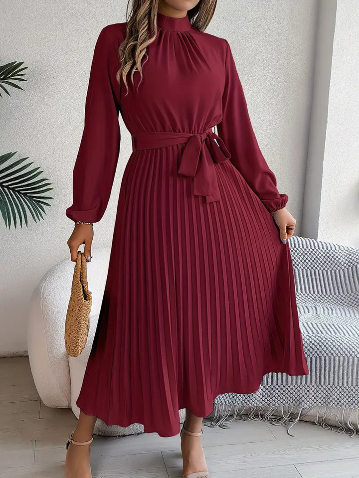 Detail of high mock neckline and gathered front on Women's Long Sleeve Pleated Belted Dress