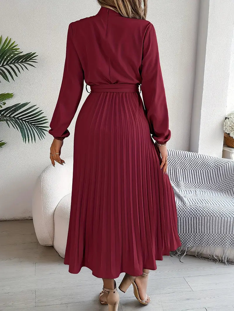 Women's Long Sleeve Pleated Belted Dress styled with heeled sandals for formal occasion