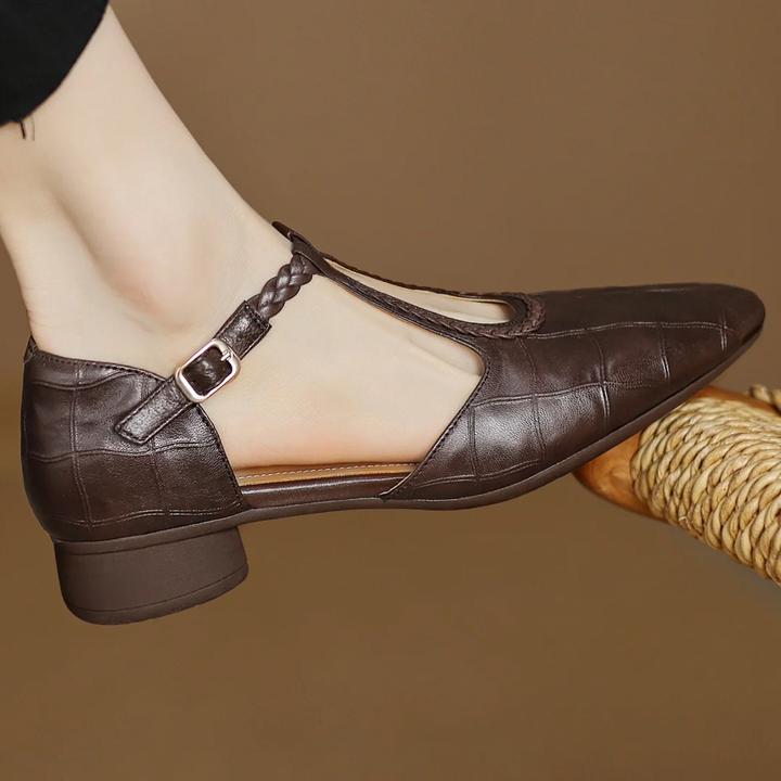 Side view of Women's Soft Leather Mary Janes displaying low block heel and structured upper
