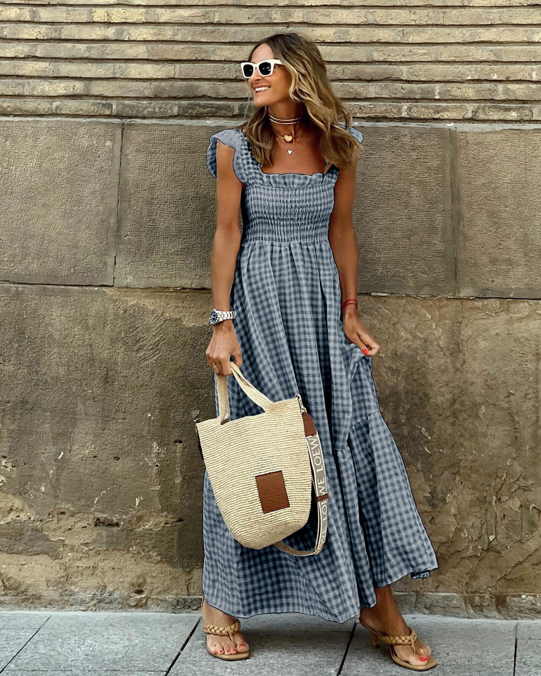 Full-length view showing the flowing skirt and gingham pattern of the summer maxi dress