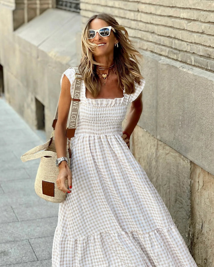 Woman styling the Elegant Summer Maxi Dress Gingham with sandals for a casual summer look