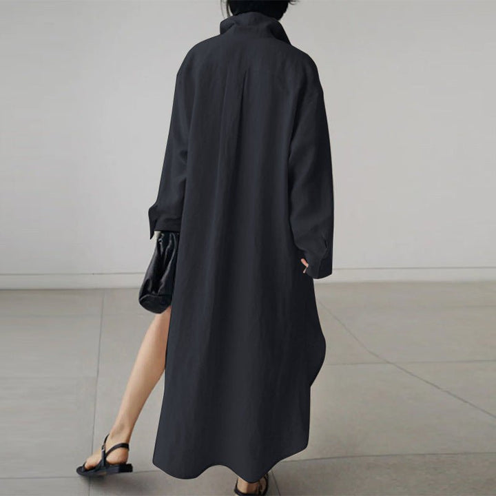 Close-up of collared neckline and button-down front detail on black linen shirt dress