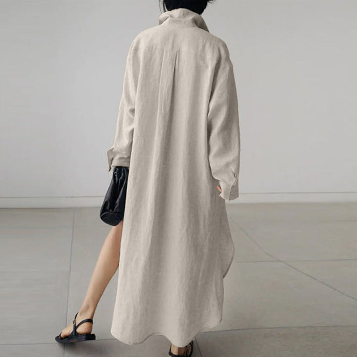 Detail of flowy silhouette and side slit on black linen midi shirt dress