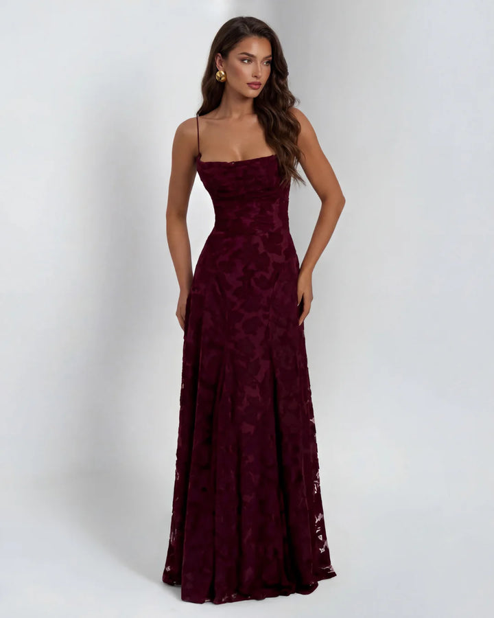 Floral lace maxi dress shown in full length with dimensional appliqué detail