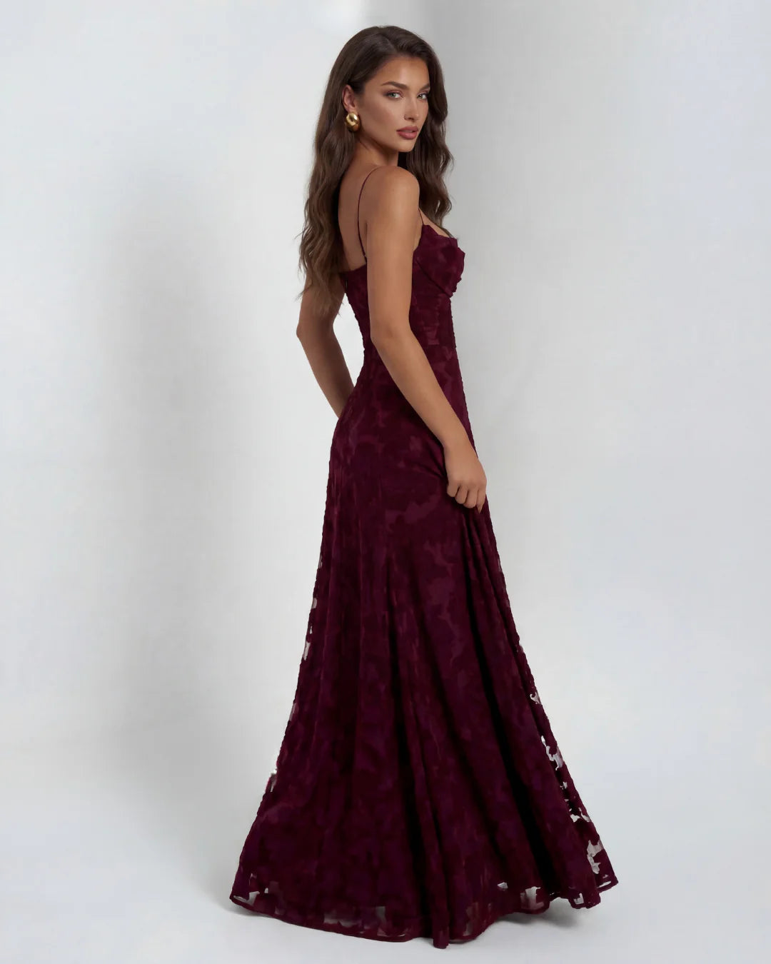 Detail shot of straight neckline and delicate lace texture on maxi dress