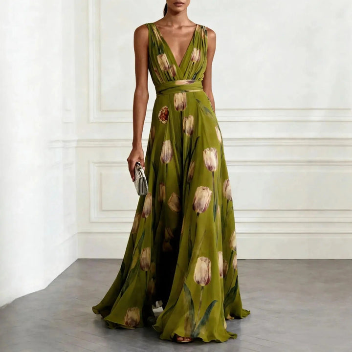 Floor-length floral dress with tie waist detail and graceful drape